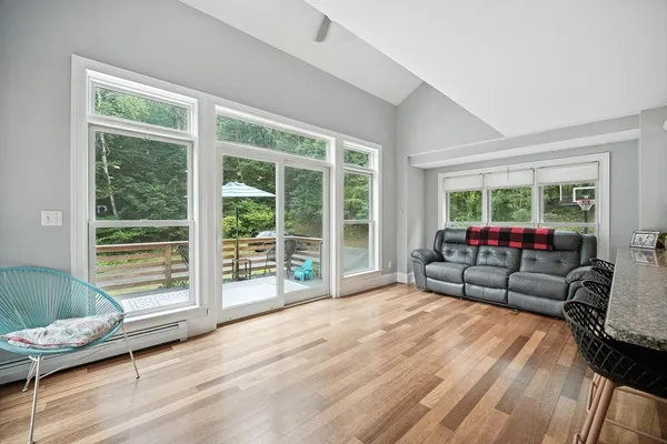 a living room with furniture and a large window