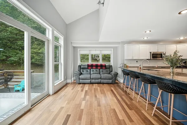 a view of kitchen with sink and wooden floor