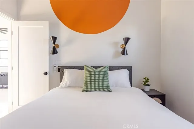 a bedroom with a bed and window