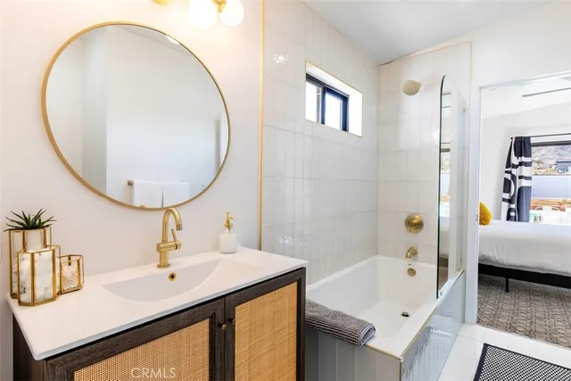 a bathroom with a sink and a mirror