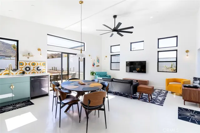 a dining room with furniture and window