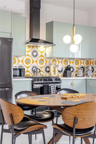 a table chair sitting in a kitchen next to a window