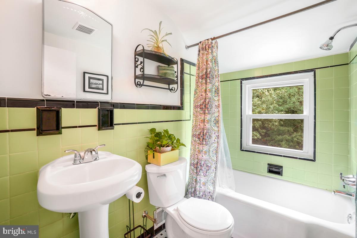 6013 Hawthorne Street Cheverly, MD 20785 - Photo 18 of 30 a bathroom with a sink toilet and shower