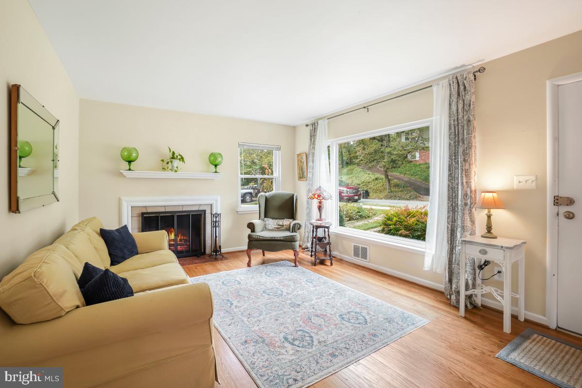6013 Hawthorne Street Cheverly, MD 20785 - Photo 5 of 30 a living room with furniture and a fireplace