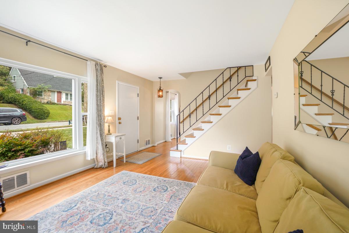 6013 Hawthorne Street Cheverly, MD 20785 - Photo 6 of 30 a living room with furniture and a large window