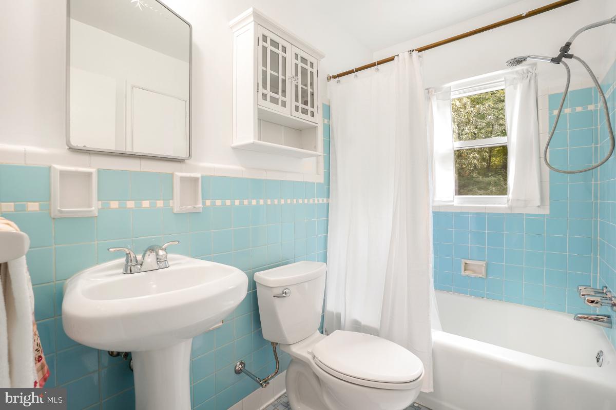 6013 Hawthorne Street Cheverly, MD 20785 - Photo 7 of 30 a bathroom with a sink a toilet and shower