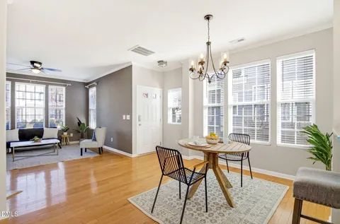 a view of a dining room with furniture window and wooden floor