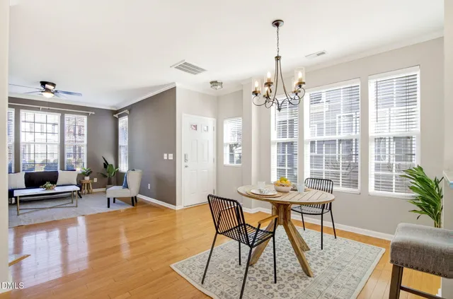 a view of a dining room with furniture window and wooden floor