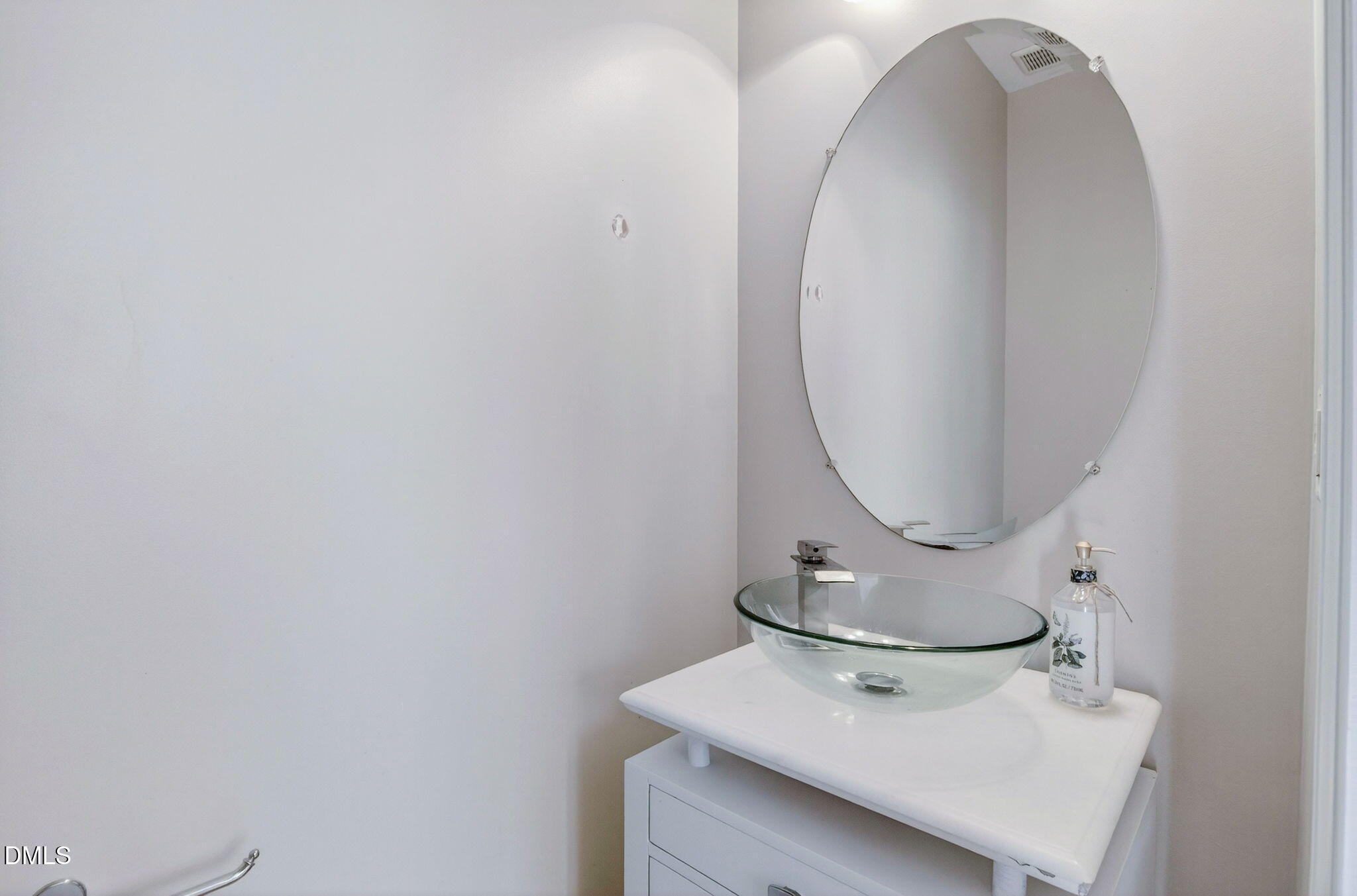 603 Cupola Drive Raleigh, NC 27603 - Photo 14 of 32 a bathroom with a sink and mirror