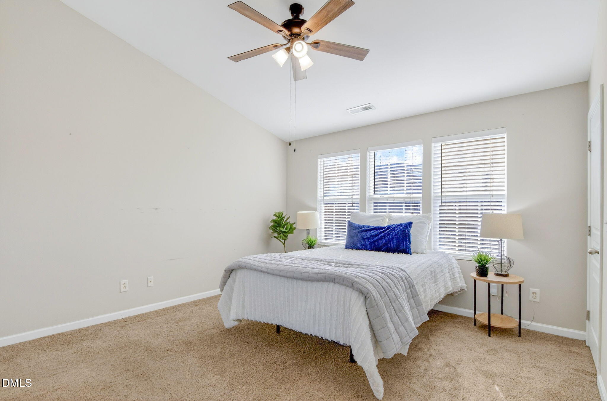 603 Cupola Drive Raleigh, NC 27603 - Photo 20 of 32 a bedroom with a bed and window