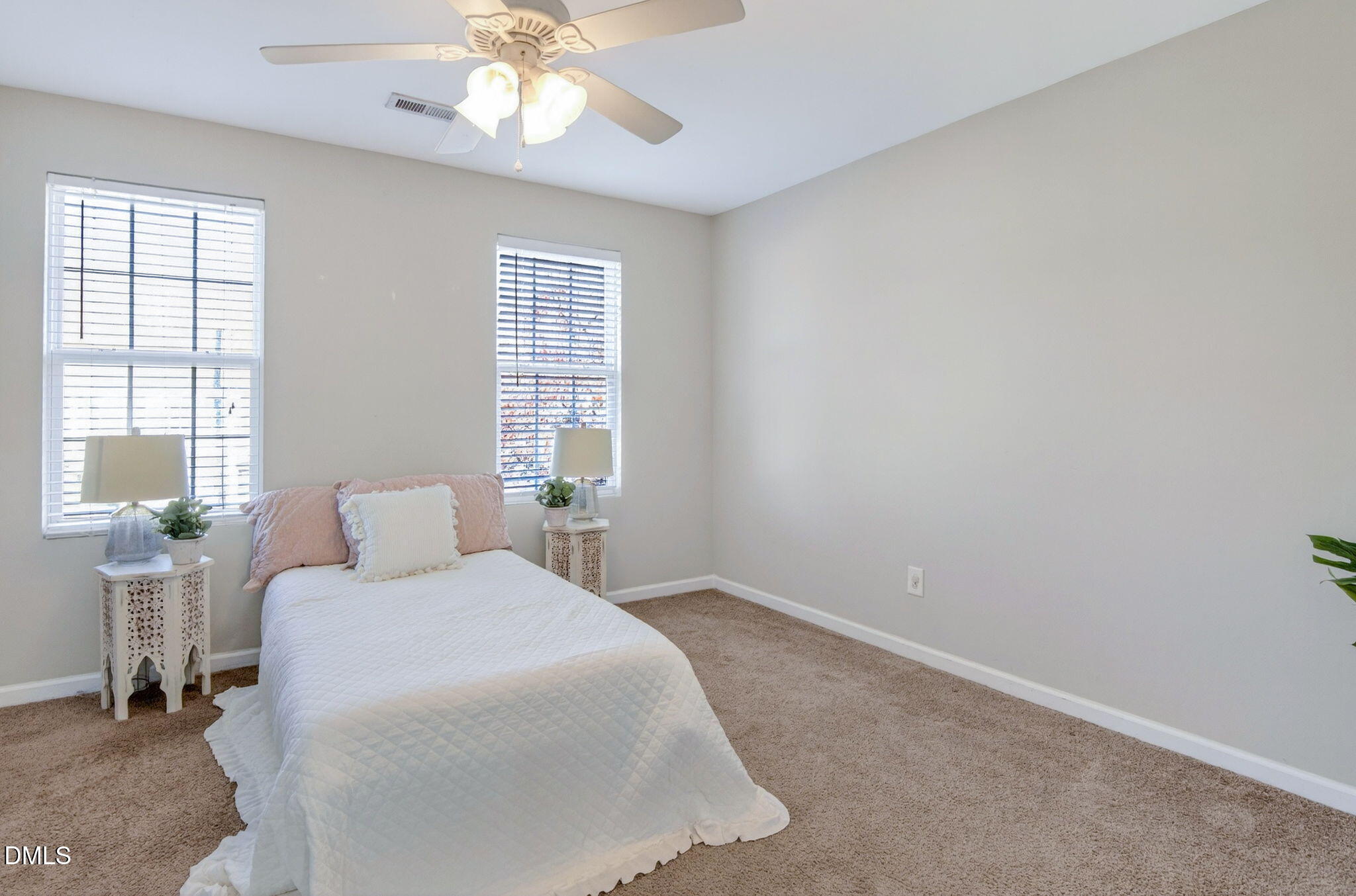 603 Cupola Drive Raleigh, NC 27603 - Photo 26 of 32 a bedroom with a bed and window