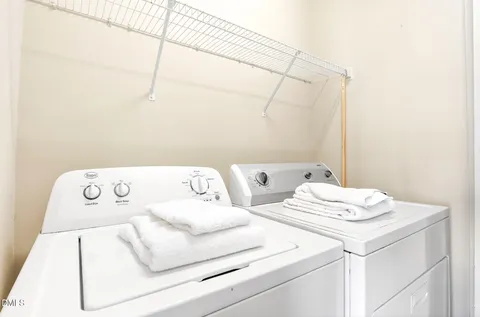 a bathroom with a sink a toilet and shower curtain