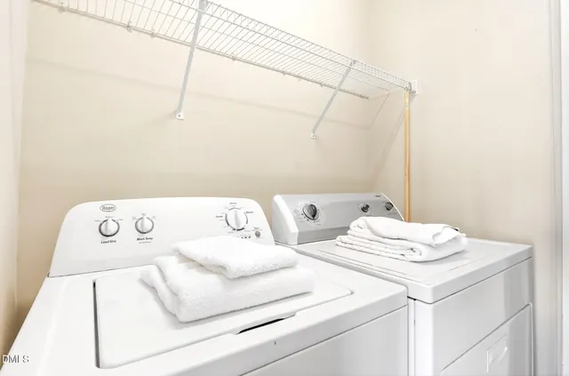 a bathroom with a sink a toilet and shower curtain