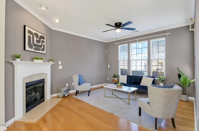 a view of a pathway that has brick walls and a potted plant