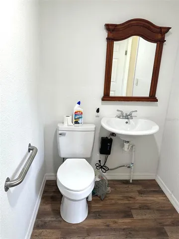 a living room with furniture and a piano