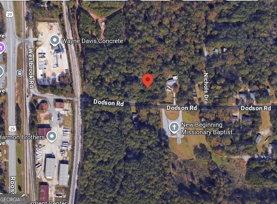 4809 Dodson Road Union City, GA 30291 - Photo 2 of 2 a sign board with buildings in the background