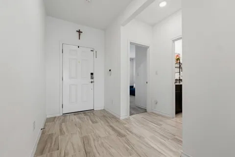 a view of a living room and hardwood floor