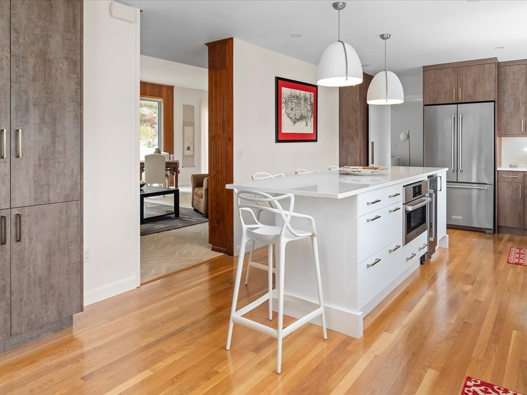 447 Albany Street Fall River, MA 02720 - Photo 19 of 33 a kitchen with stainless steel appliances a stove top oven a refrigerator and cabinets