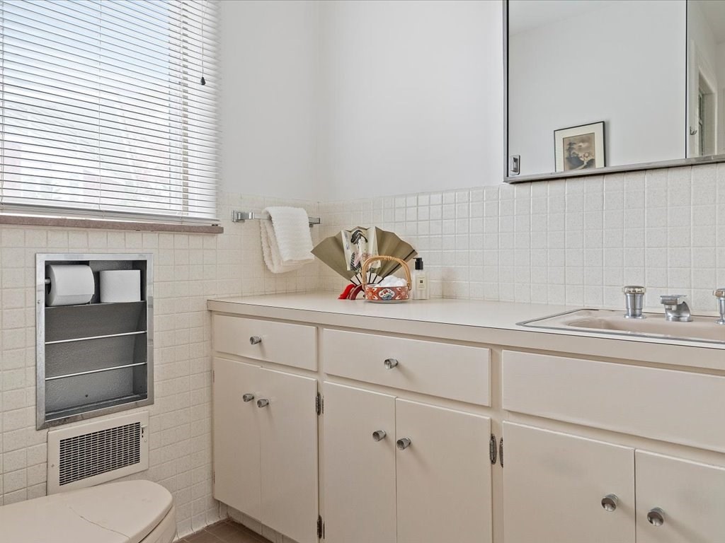 447 Albany Street Fall River, MA 02720 - Photo 28 of 33 a kitchen with a cabinets and a window