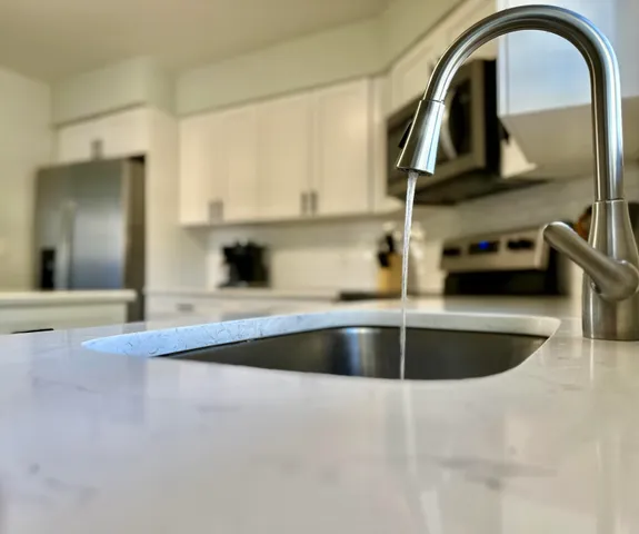 a kitchen with a sink and a stove