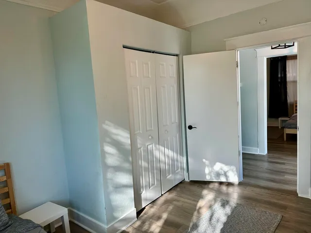 a view of a livingroom with wooden floor