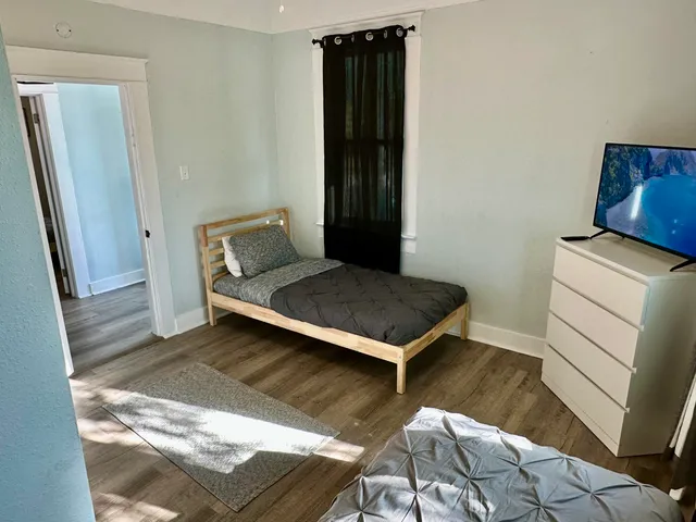 a living room with a couch and a rug