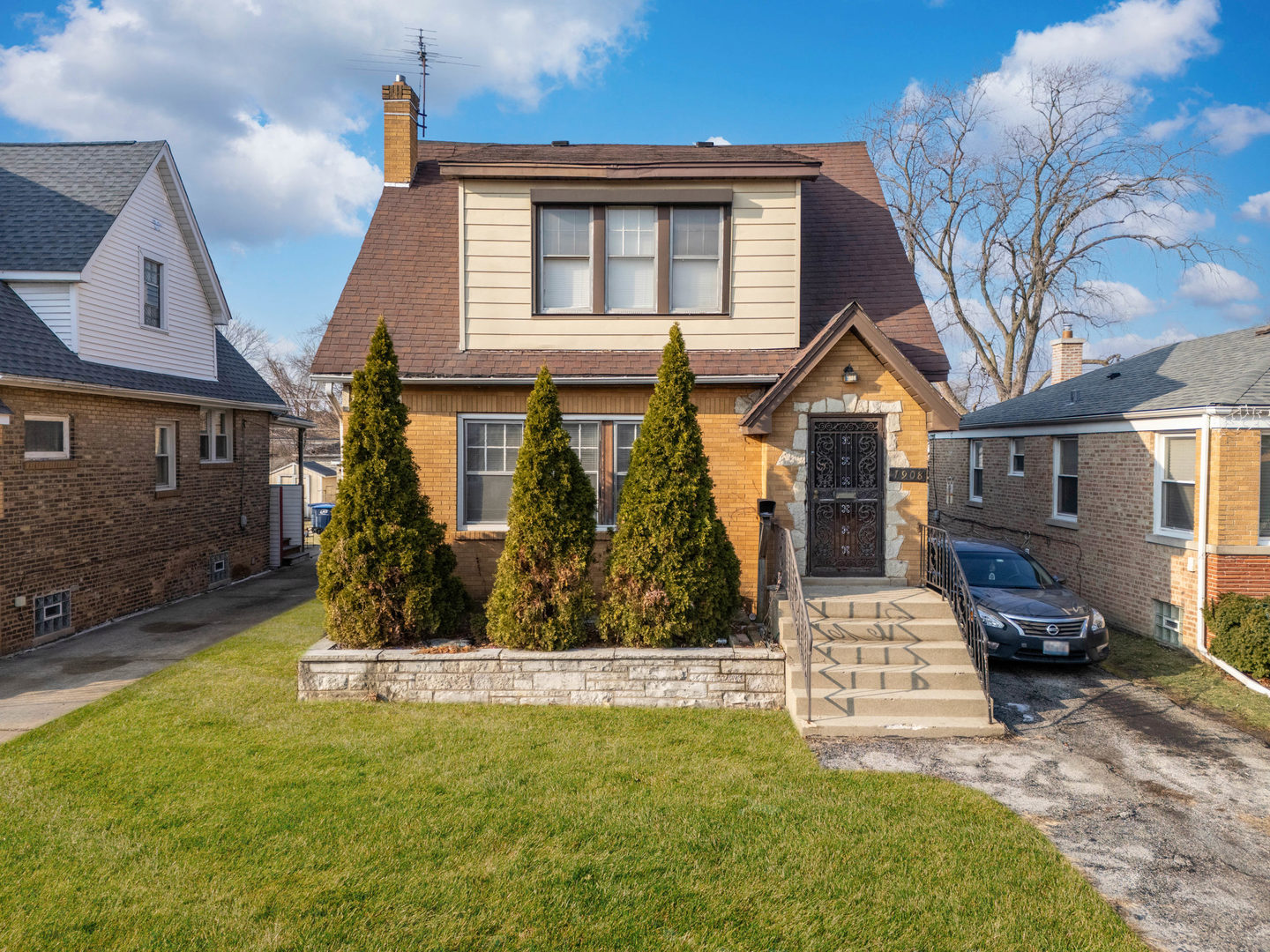 a front view of a house with a yard