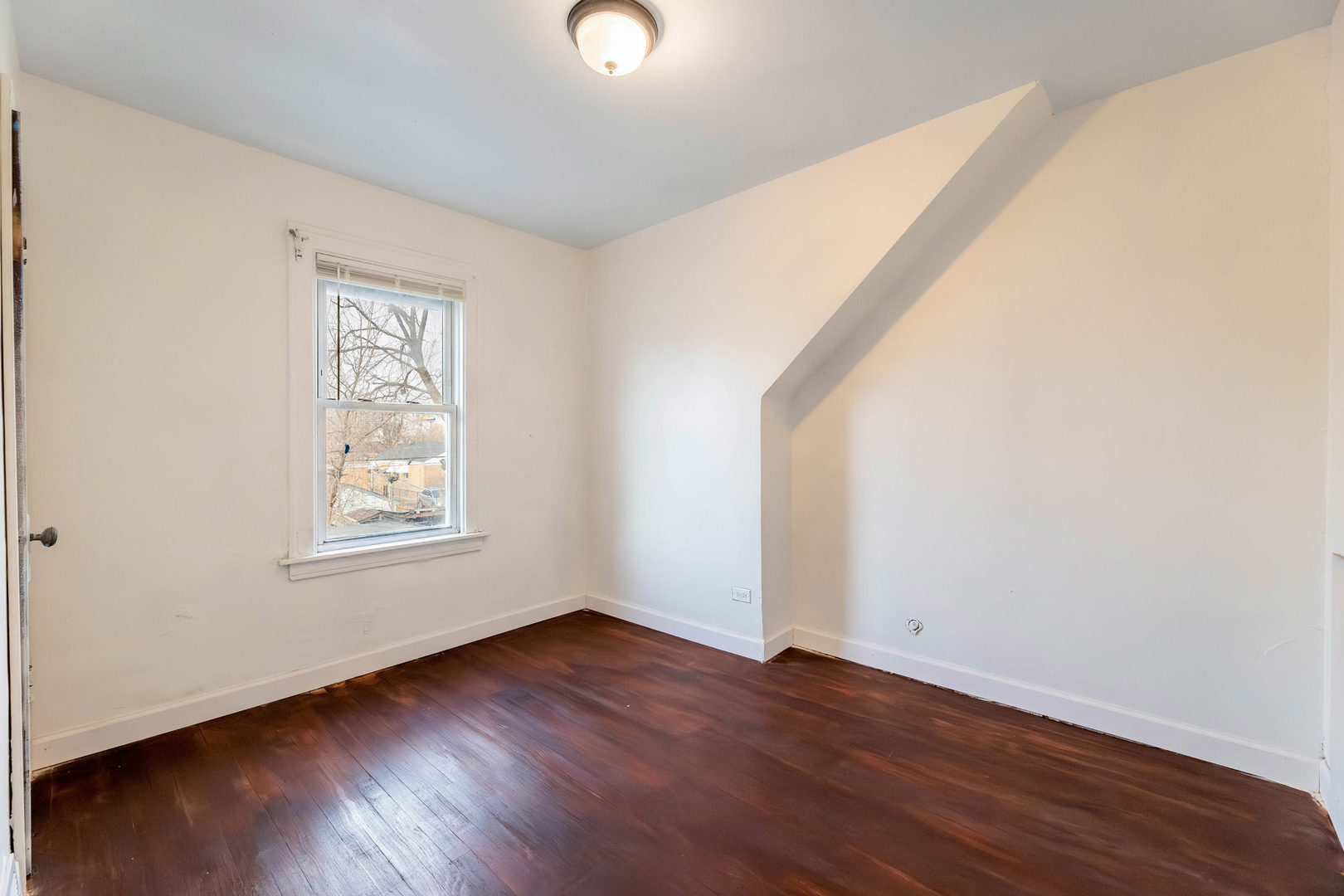 1908 South 23rd Avenue Maywood, IL 60153 - Photo 20 of 37 an empty room with wooden floor and windows