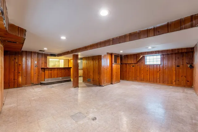 a bathroom with a sink vanity mirror and toilet