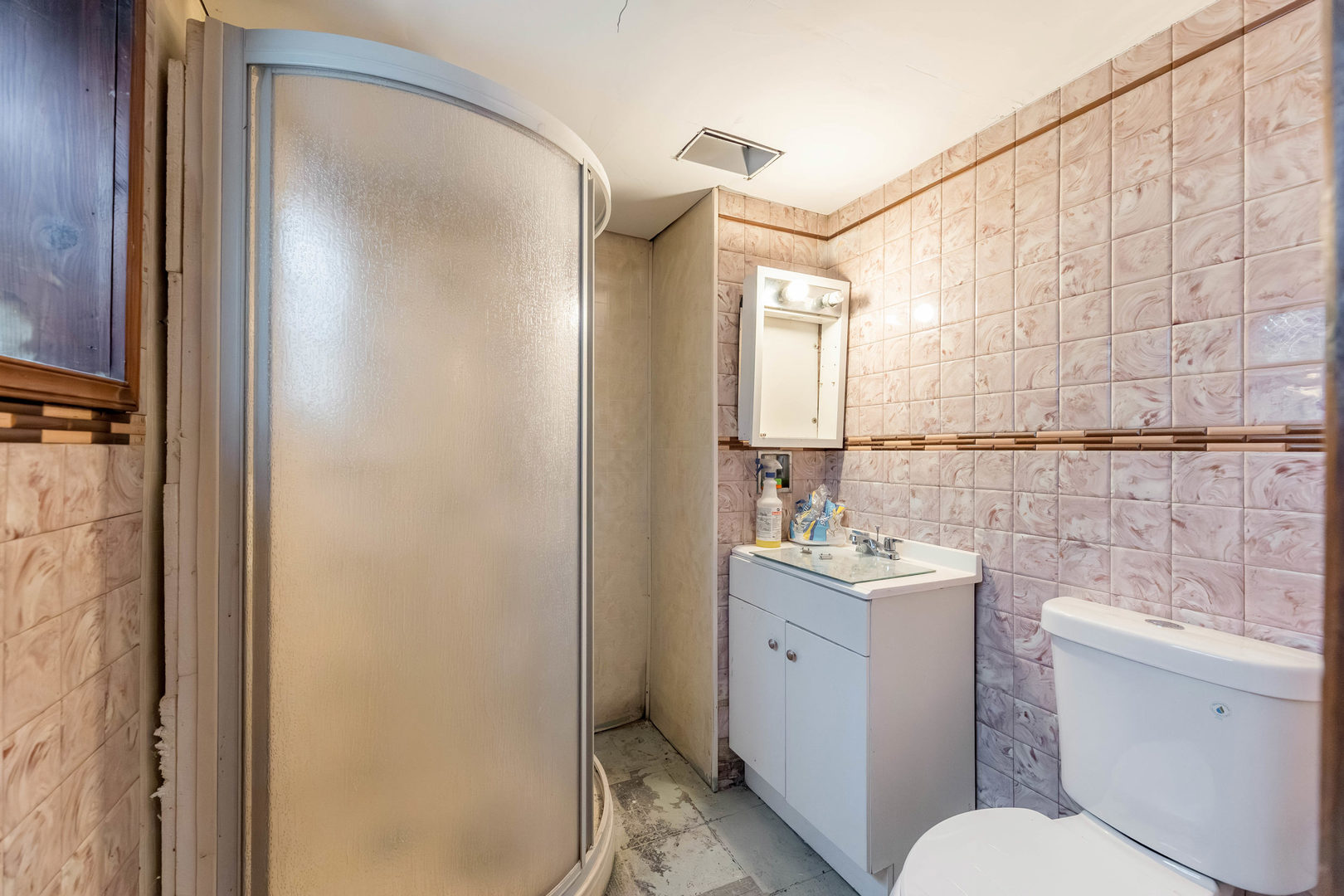 1908 South 23rd Avenue Maywood, IL 60153 - Photo 25 of 37 a bathroom with a sink vanity mirror and toilet