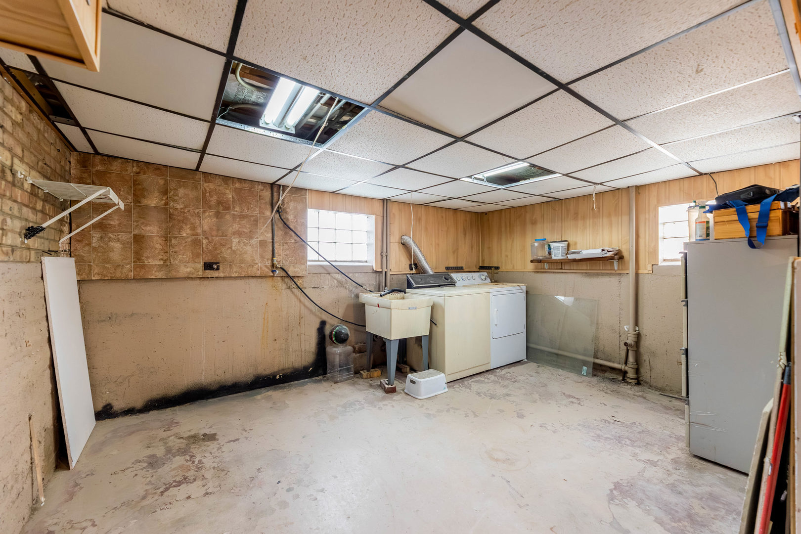 1908 South 23rd Avenue Maywood, IL 60153 - Photo 26 of 37 a view of a storage & utility room with refrigerator and windows