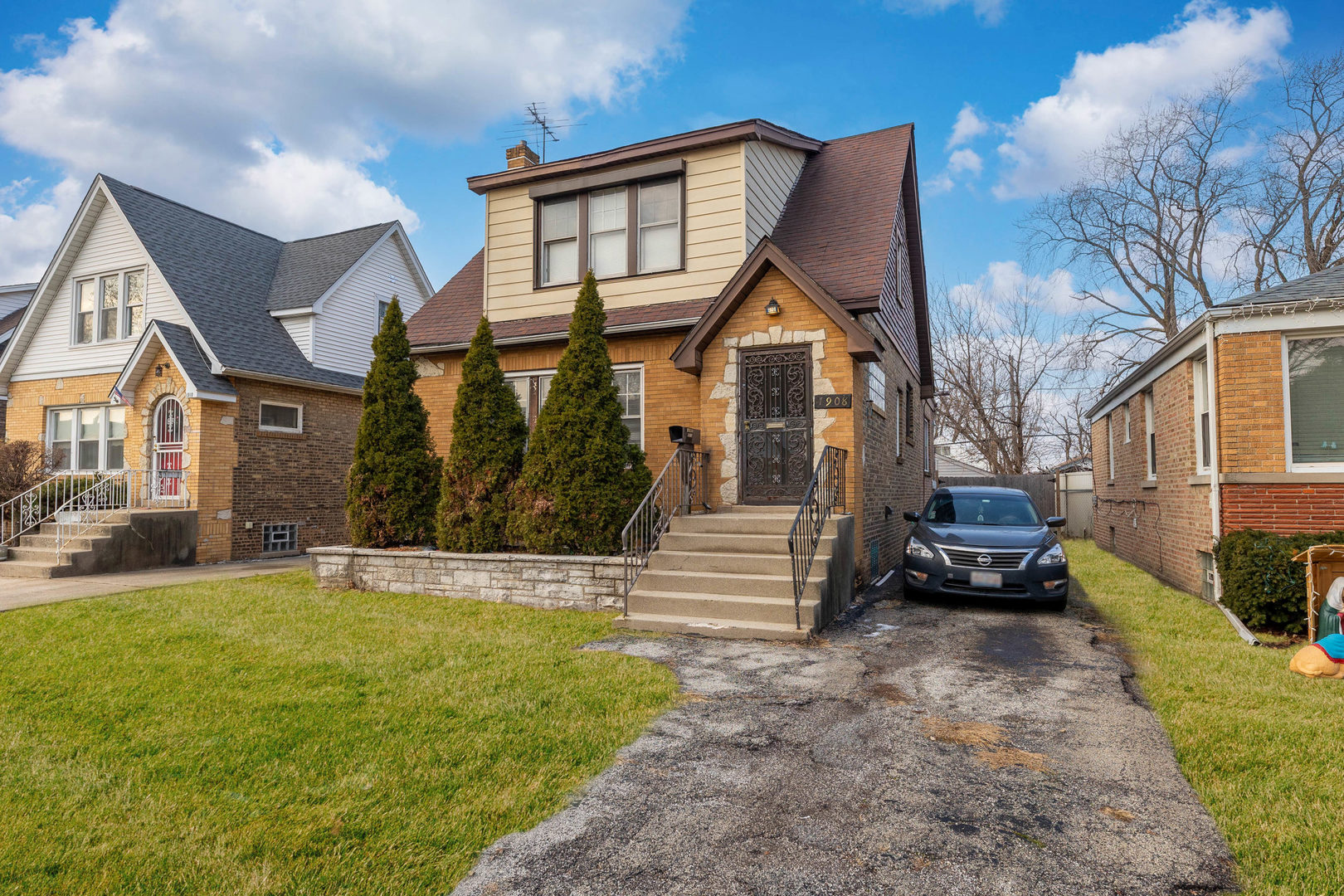 1908 South 23rd Avenue Maywood, IL 60153 - Photo 31 of 37 a front view of a house with a yard