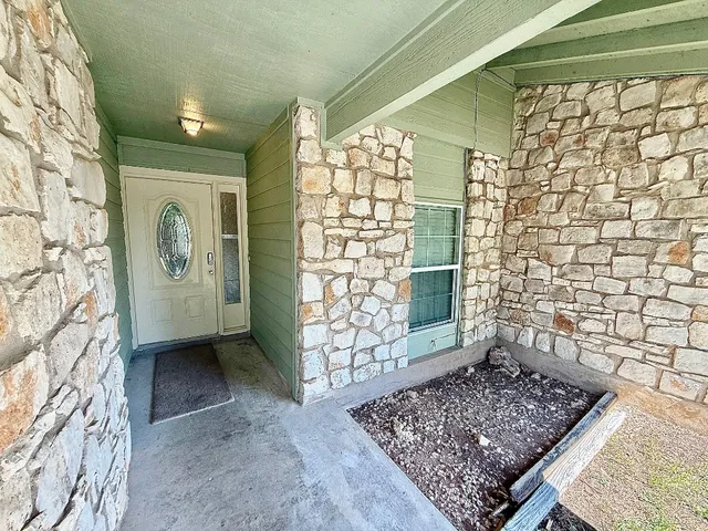 a view of entryway with a rug and a window