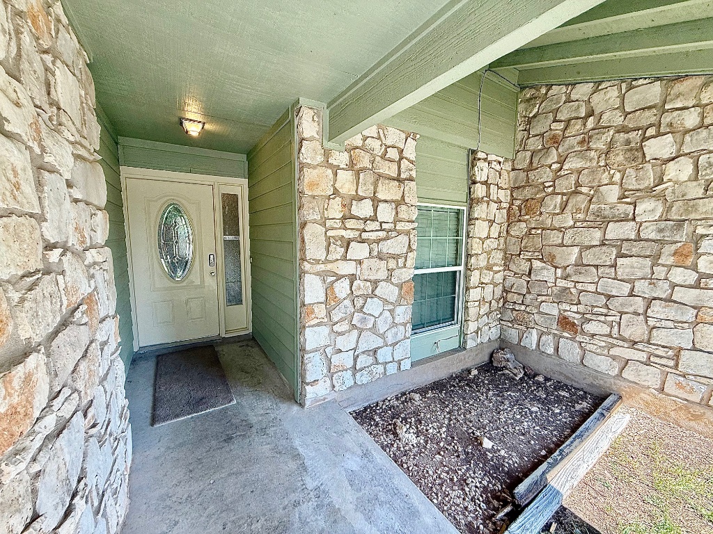 12102 Grey Fawn Path Austin, TX 78750 - Photo 2 of 24 a view of entryway with a rug and a window