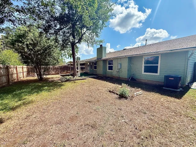 a house with trees in the background