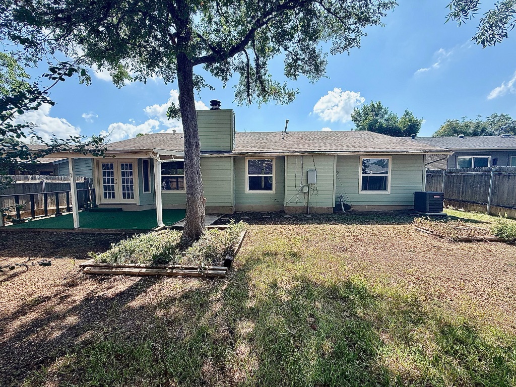 12102 Grey Fawn Path Austin, TX 78750 - Photo 24 of 24 a house with trees in the background