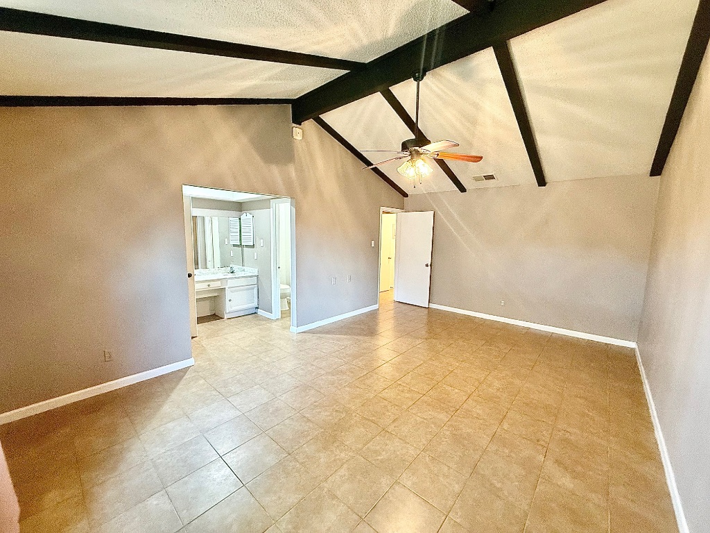 12102 Grey Fawn Path Austin, TX 78750 - Photo 10 of 24 a view of a big room with wooden floor and door