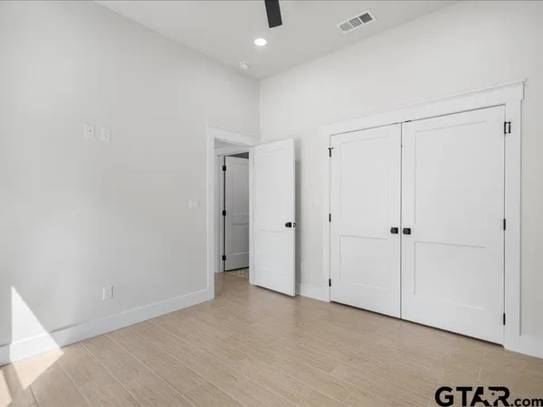 a view of a hallway with washer and dryer