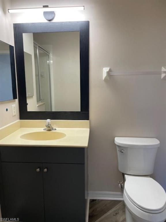3610 Lansing Loop, Unit 103 Estero, FL 33928 - Photo 13 of 33 Guest Bathroom with vanity. New LED light and comfort height toilet.