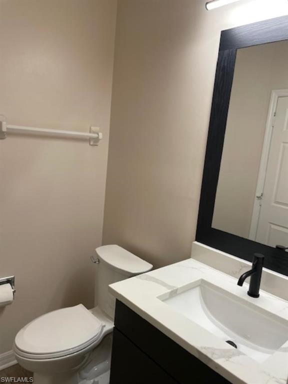 3610 Lansing Loop, Unit 103 Estero, FL 33928 - Photo 14 of 33 Half bath with vanity and comfort height toilet.