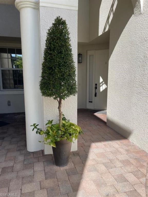 3610 Lansing Loop, Unit 103 Estero, FL 33928 - Photo 2 of 33 Walkway to front door on right.