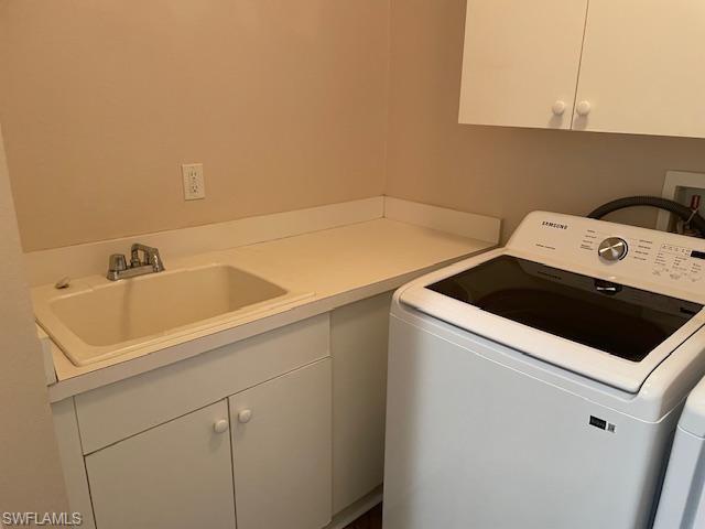 3610 Lansing Loop, Unit 103 Estero, FL 33928 - Photo 29 of 40 Cabinets over washer and dryer. Laundry sink.