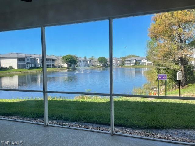 3610 Lansing Loop, Unit 103 Estero, FL 33928 - Photo 31 of 40 Water view from lanai featuring 2 lit fountains.