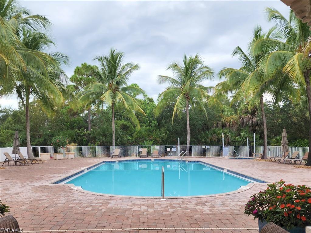 3610 Lansing Loop, Unit 103 Estero, FL 33928 - Photo 31 of 33 Community pool featuring a paver patio.