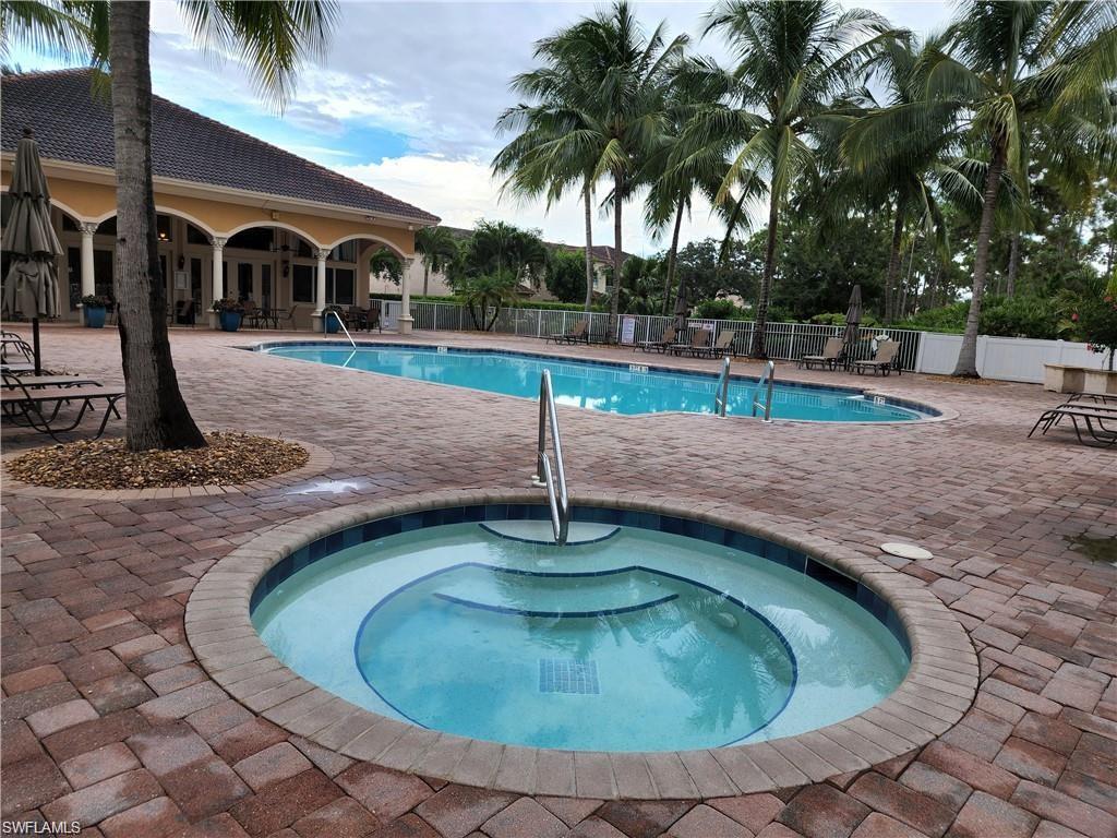 3610 Lansing Loop, Unit 103 Estero, FL 33928 - Photo 32 of 33 Pool with a community hot tub