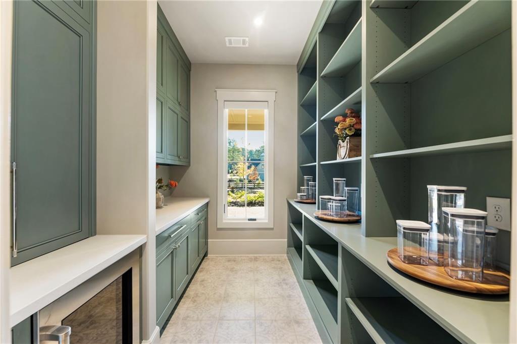 1000 Haddie Way Alpharetta, GA 30004 - Photo 30 of 95 a kitchen with counter top space and stainless steel appliances