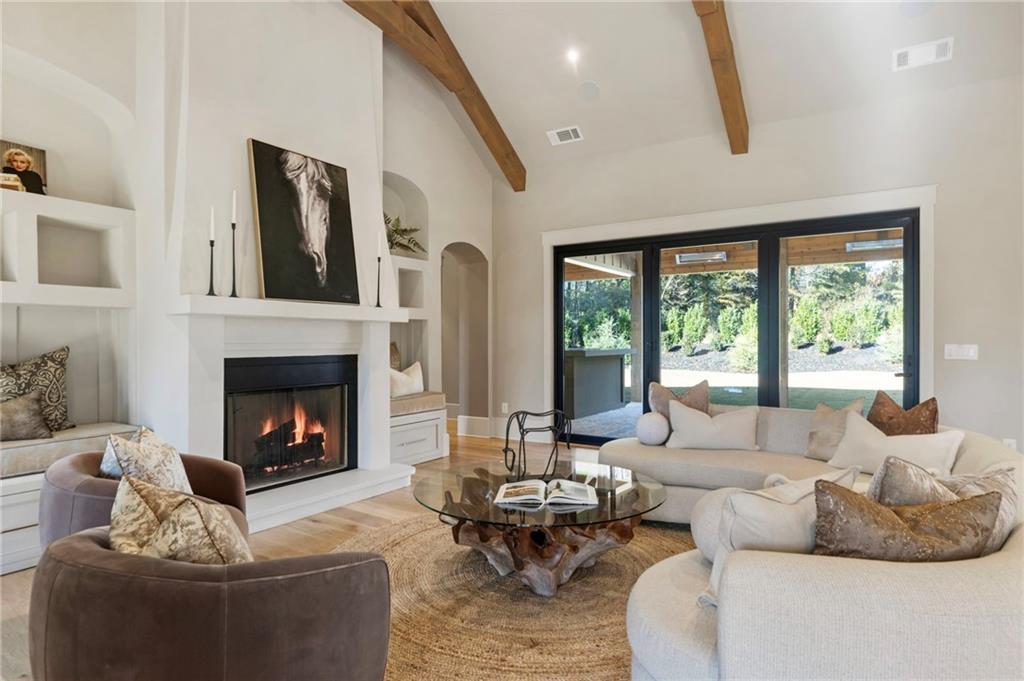 1000 Haddie Way Alpharetta, GA 30004 - Photo 35 of 95 a living room with furniture large window and a fireplace