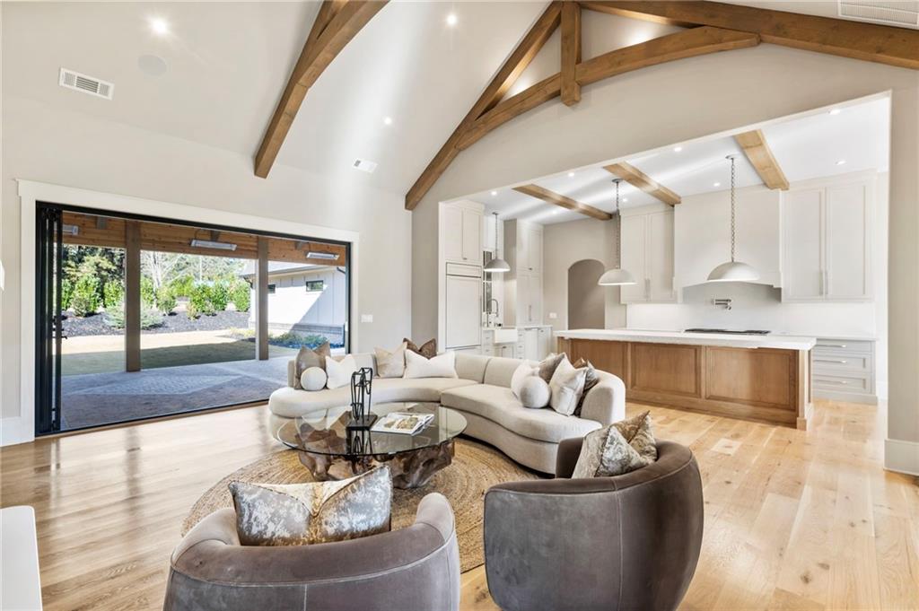 1000 Haddie Way Alpharetta, GA 30004 - Photo 36 of 95 a living room with furniture and a large window