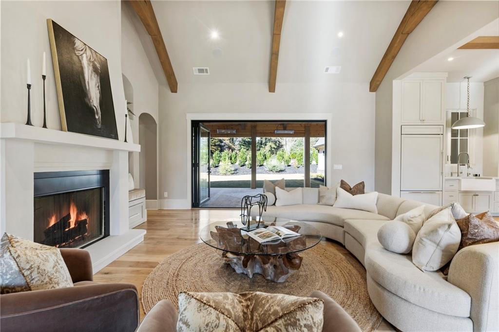 1000 Haddie Way Alpharetta, GA 30004 - Photo 38 of 95 a living room with furniture fireplace and a large window