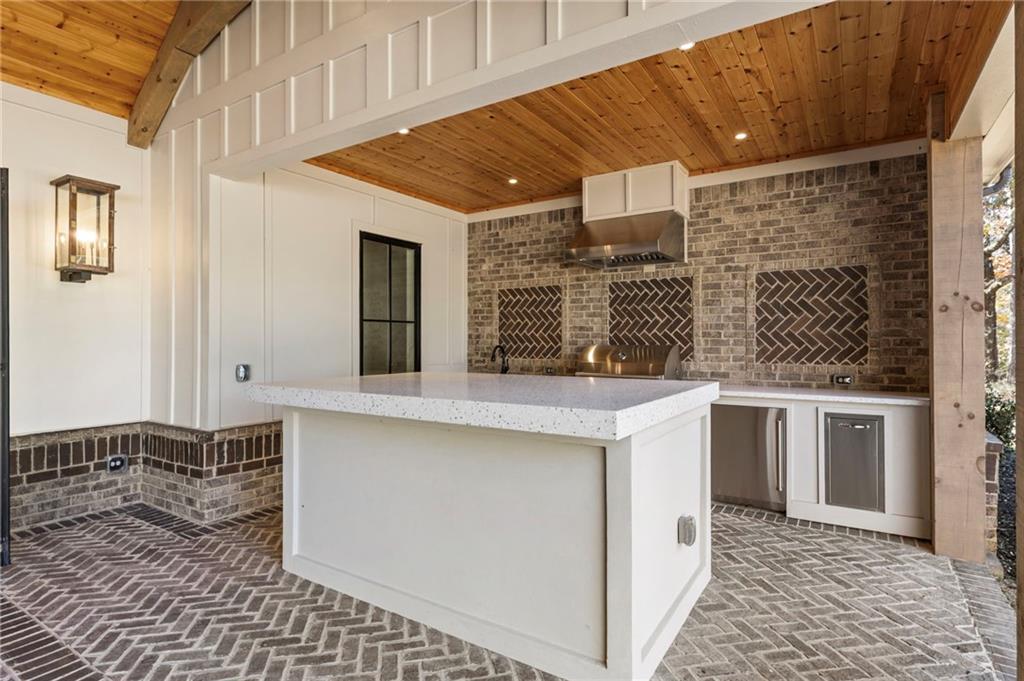 1000 Haddie Way Alpharetta, GA 30004 - Photo 48 of 95 a kitchen with stainless steel appliances a sink stove and cabinets